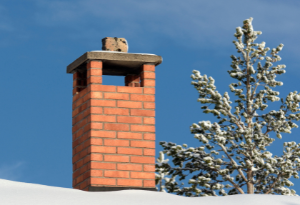 residential chimney with winter snow
